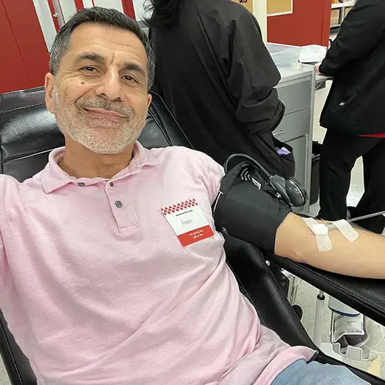 Feras Alhlou donating blood to the red cross
